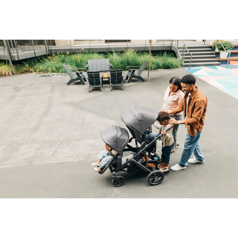 Twins ride comfortably in the UPPAbaby Vista V3 Twin Double Stroller in Noa, showcasing the twin stroller design