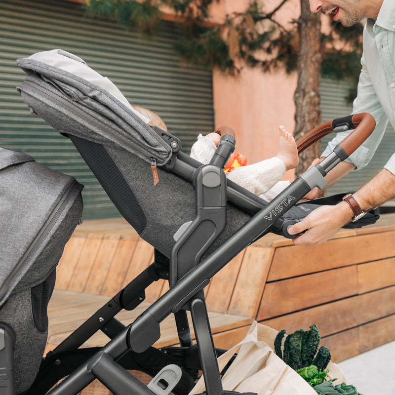 Greyson UPPAbaby Vista V3 stroller with a child inside and Rumbleseat V3 toddler seat.
