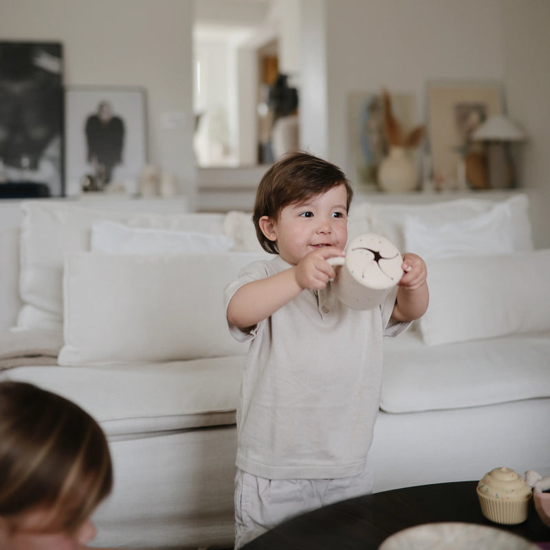 Mushie Silicone Snack Cup in Vanilla Confetti combining a playful look with durability for snack storage