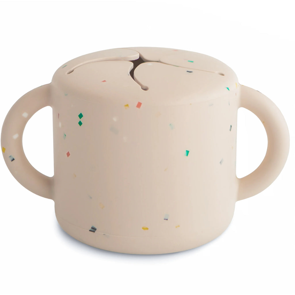 Mushie Silicone Snack Cup in Vanilla Confetti featuring a fun design and easy-to-clean silicone material