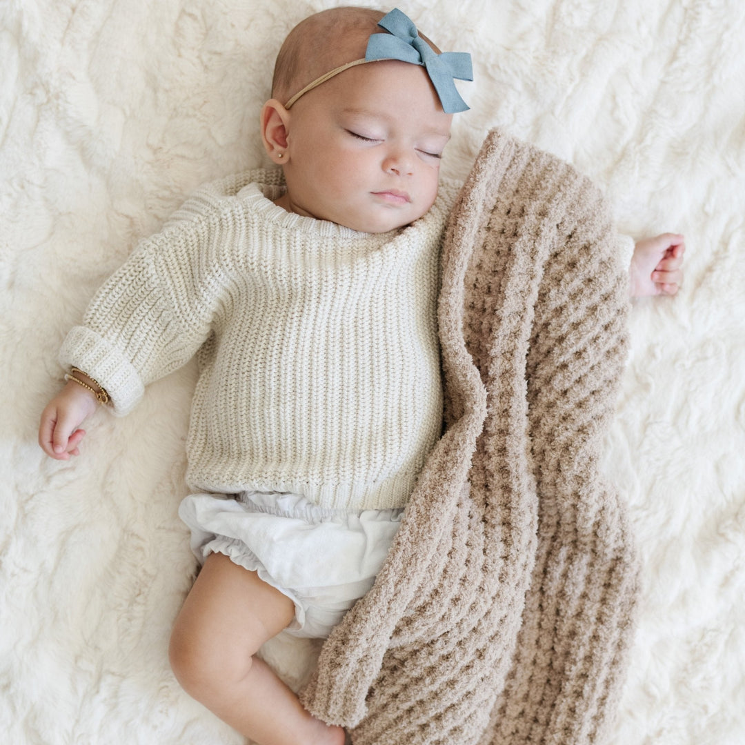 Saranoni Waffle Knit Mini Blanket in Wheat layers textured softness and simple warmth as the Best baby blankets pick.