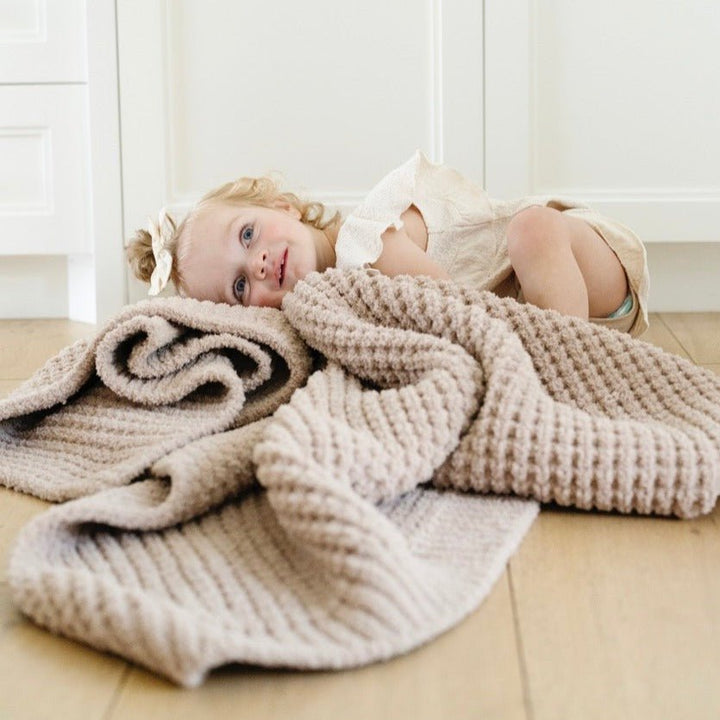 Keep little hands cozy with the Wheat Saranoni Waffle Knit Receiving Blanket, a knitted baby blanket.