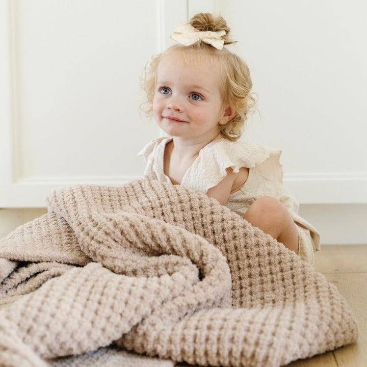 Saranoni Waffle Knit Receiving Blanket in Wheat brings softness as a baby blanket for nursery use.