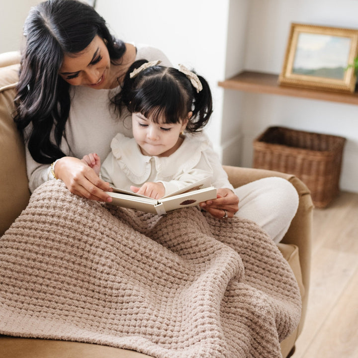 Wheat Saranoni Waffle Knit Receiving Blanket makes a gentle baby girl blanket perfect for gifting.