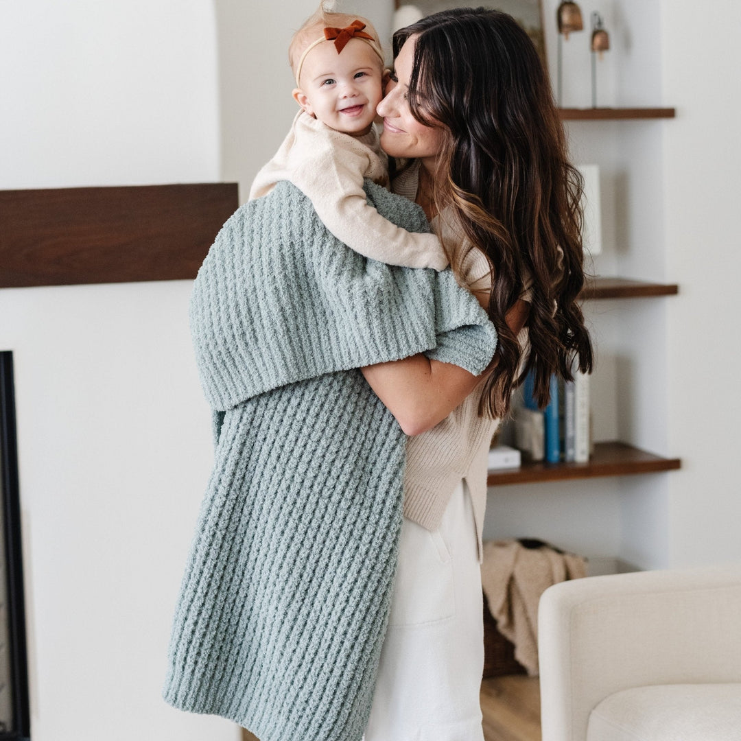 The Elm Saranoni Waffle Knit Receiving Blanket doubles as a toddler blanket for cozy naps.