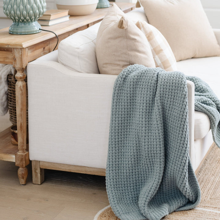 The Saranoni Waffle Knit Toddler Blanket in Elm combines warmth and breathability, ideal for soft baby blankets.