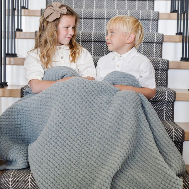 Saranoni Waffle Knit Toddler Blanket in Elm features rich texture and softness, perfect as a baby boy blanket.