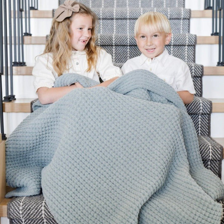 Crafted for everyday comfort, the Elm Saranoni Waffle Knit Toddler Blanket stands out among the best baby blankets.
