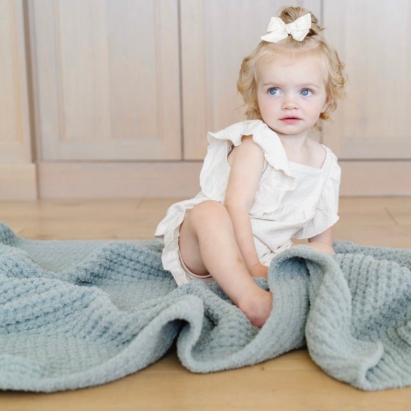 Saranoni Waffle Knit Toddler Blanket in Elm offers soothing texture that makes it one of the best toddler blankets.