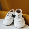 The white and black little love bug sneakers.