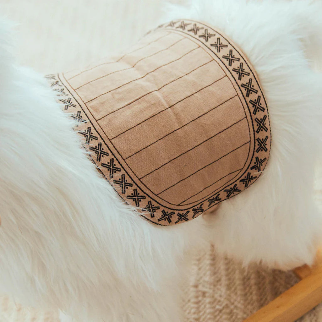 Close-up of Wonder & Wise Alpaca Rocker Toy saddle detail, premium stitching and natural wood craftsmanship