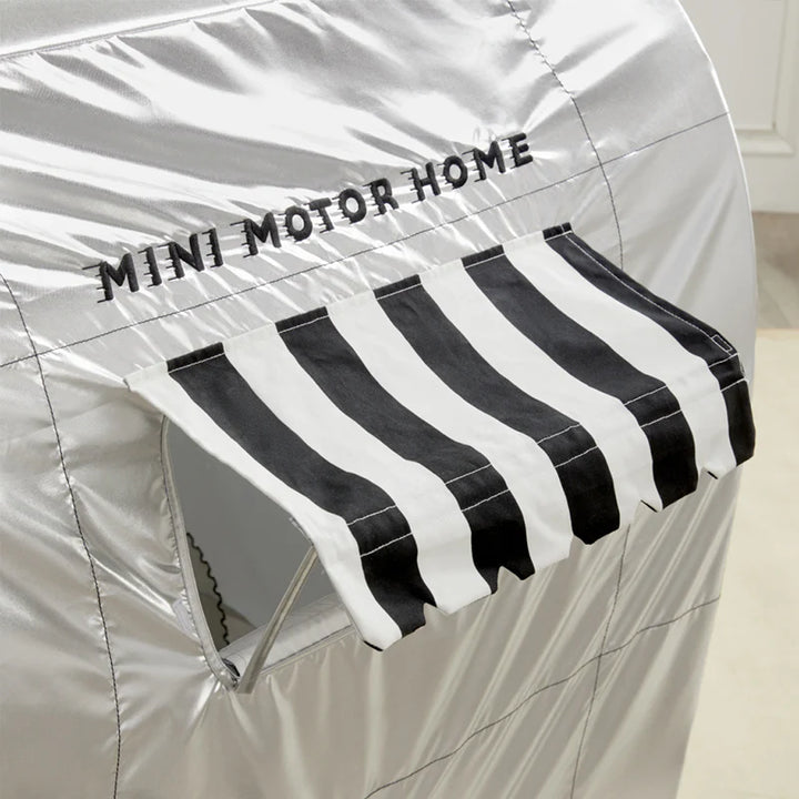 black and white awning on gray wonder and wise childrens motor home playten