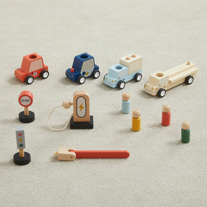 All 12 wooden pieces from the Take with Me Garage playset including cars, trucks, peg people, ramps, and signs