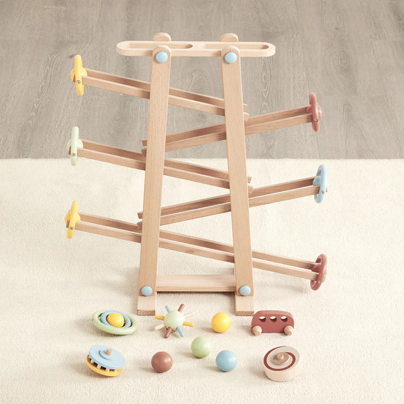 wooden wonder and wise tumble track which included wooden wheels and balls for toddler learning