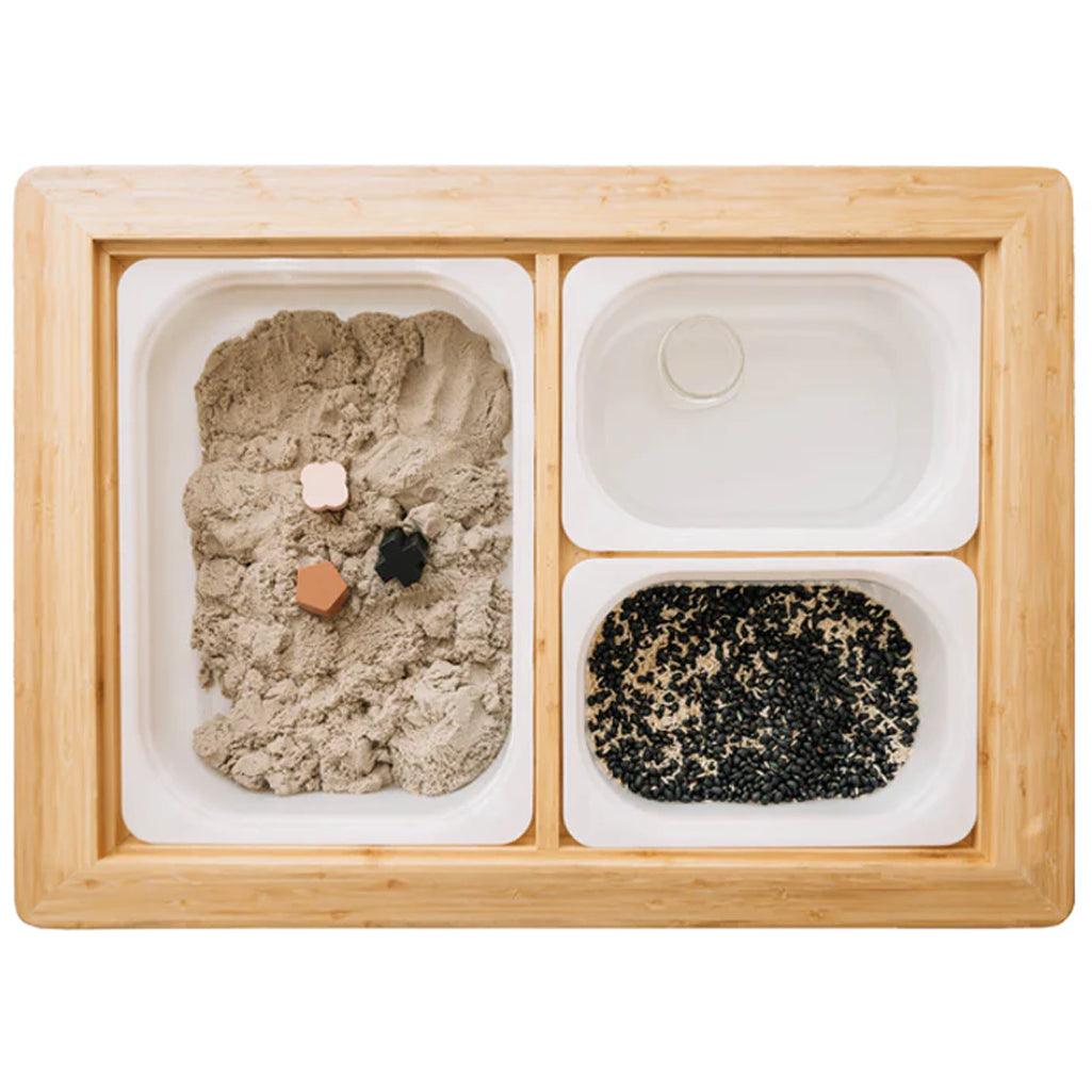 top of the land, sea, and water childrens activity table showing three bins to hold sand and water for stem learning 