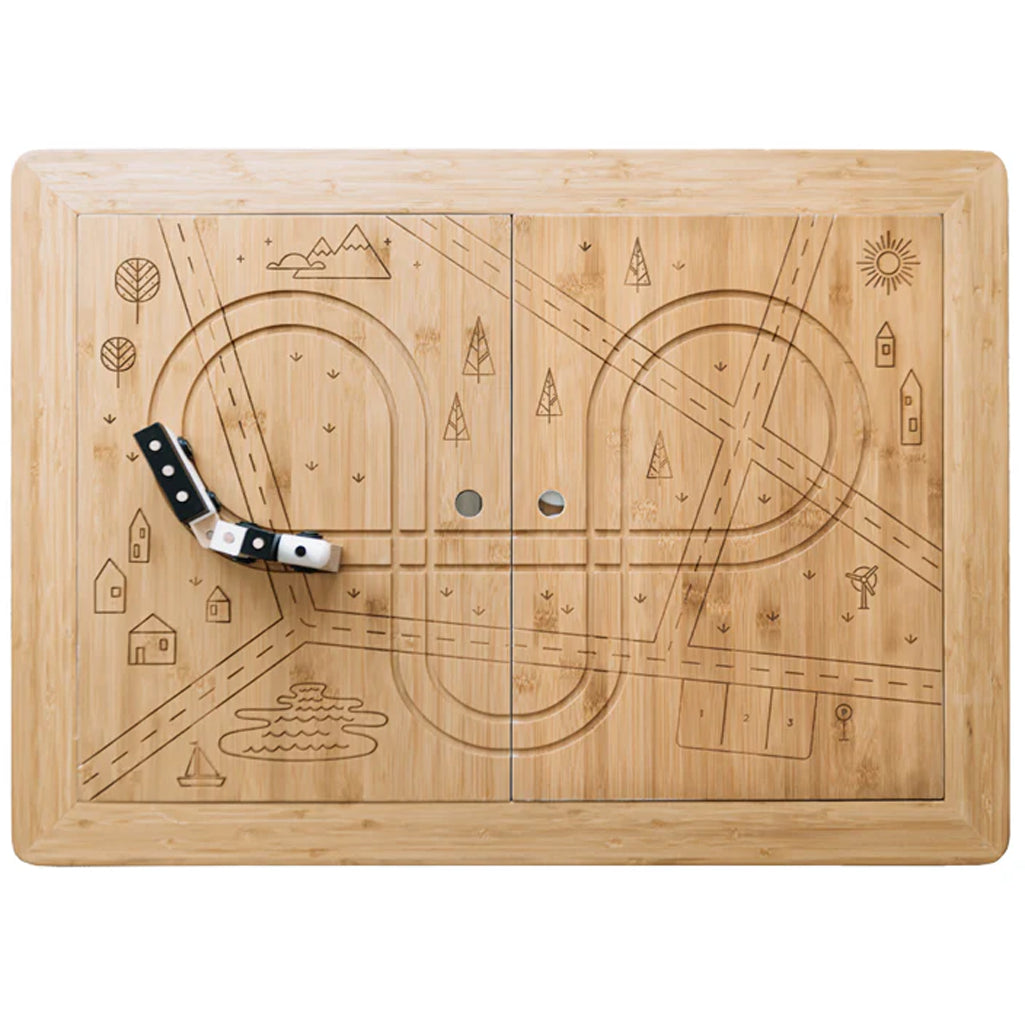 top of the sea, sand, and water wonder and wise table with train tracks carved into the wooden top 