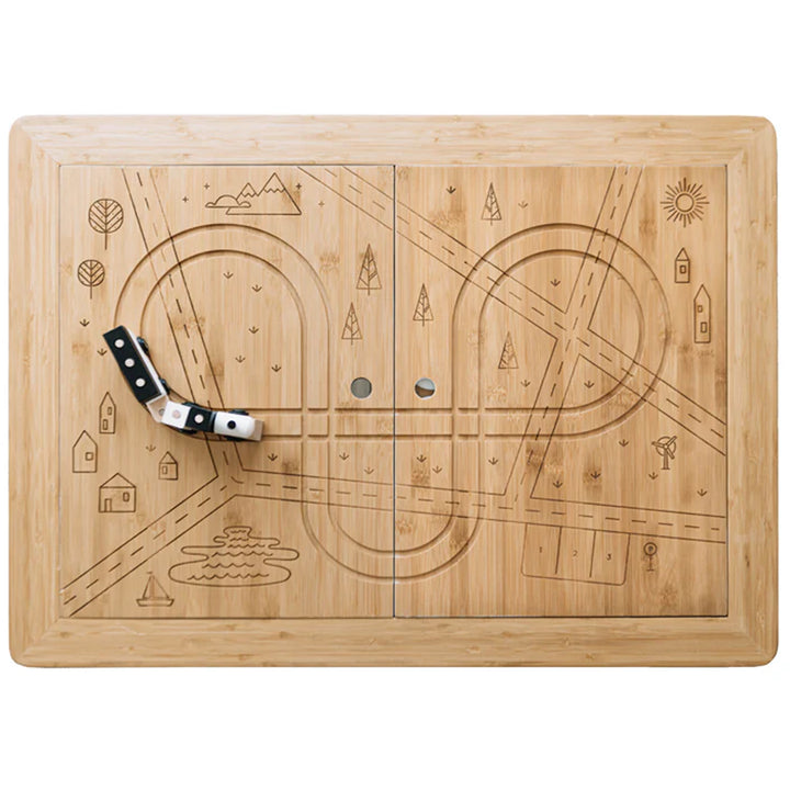 top of the sea, sand, and water wonder and wise table with train tracks carved into the wooden top 