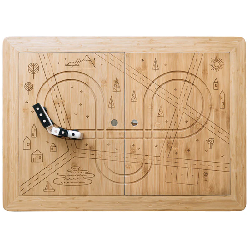 top of the sea, sand, and water wonder and wise table with train tracks carved into the wooden top 