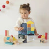 little girl playing with petite collage animal building blocks city