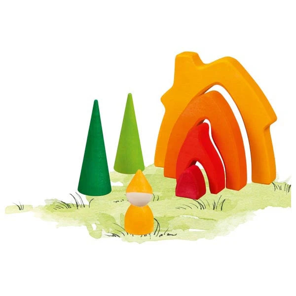 Colorful wooden toy dwarf cottage with trees and a gnome