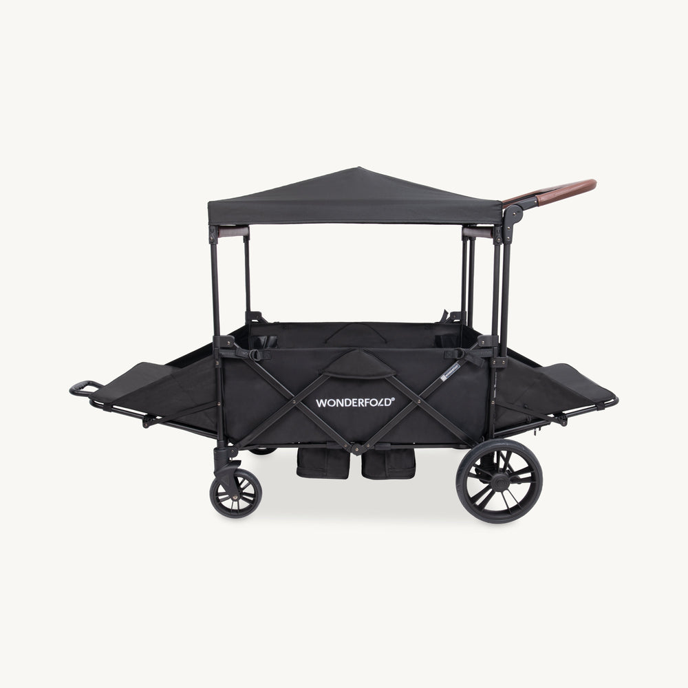 Reclining seats on the Black Wonderfold X4R Quad Stroller Wagon, a push and pull wagon for kids