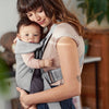 infant with mom wearing babybjorn baby carrier mini grey