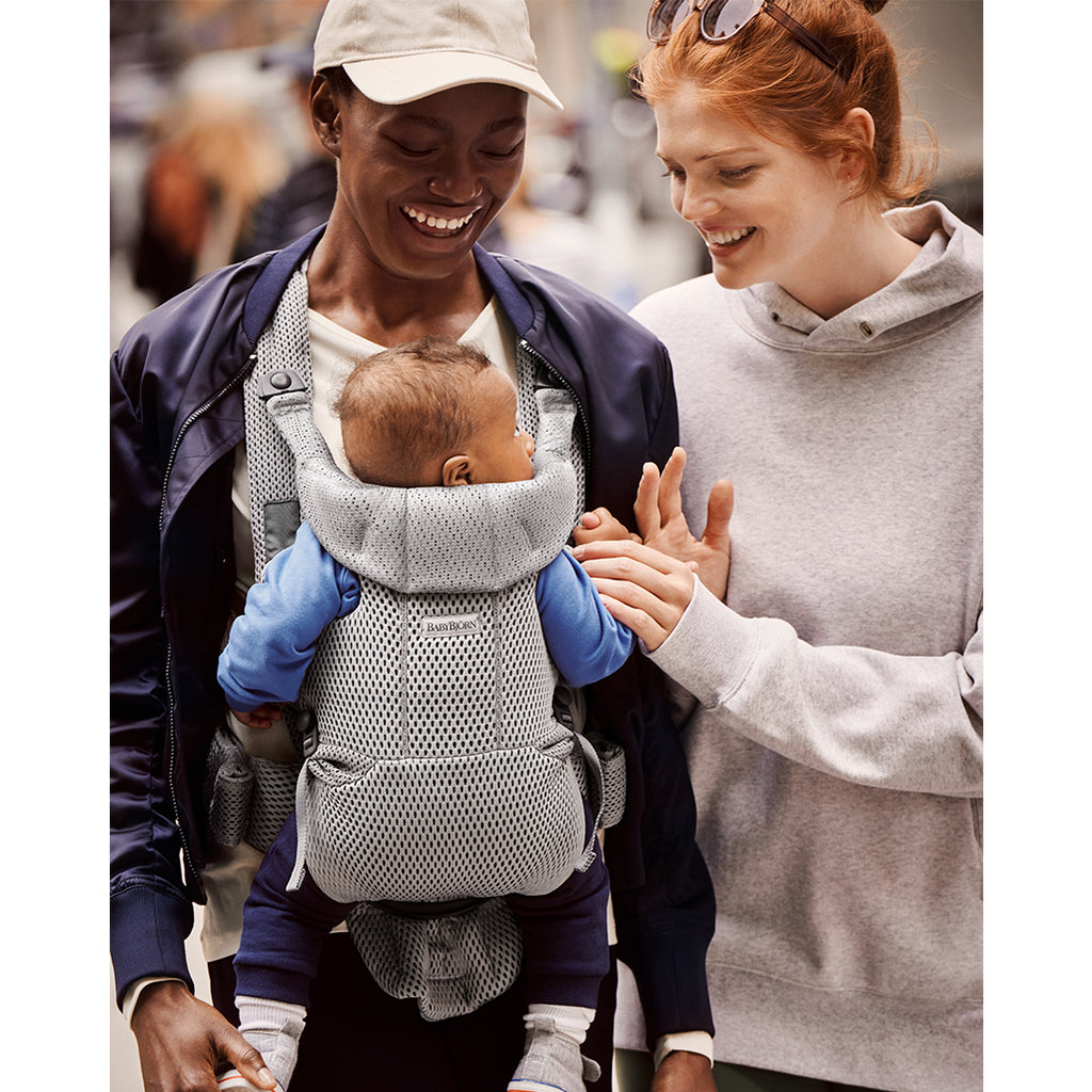 parents walking with baby in best baby carrier baby bjorn free