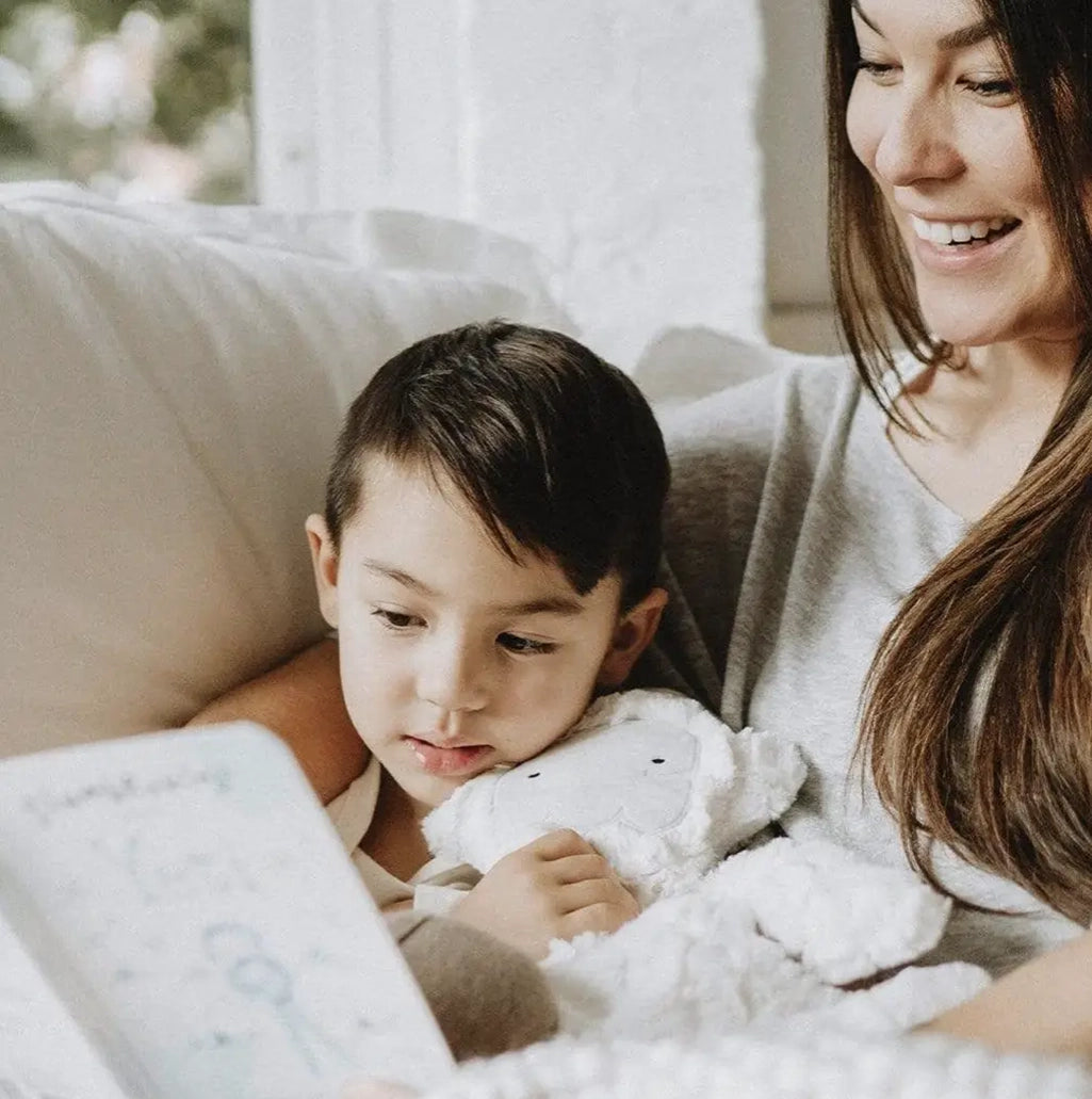 mom reading to child about mindfulness with Slumberkins Alpine Yeti 