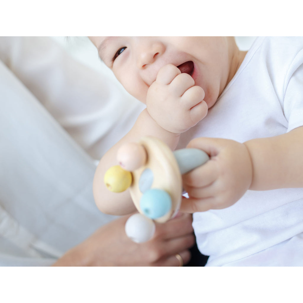 lifestyle_3, Plan Toys Pastel Wooden Bell Rattle Infant Baby Activity Toy