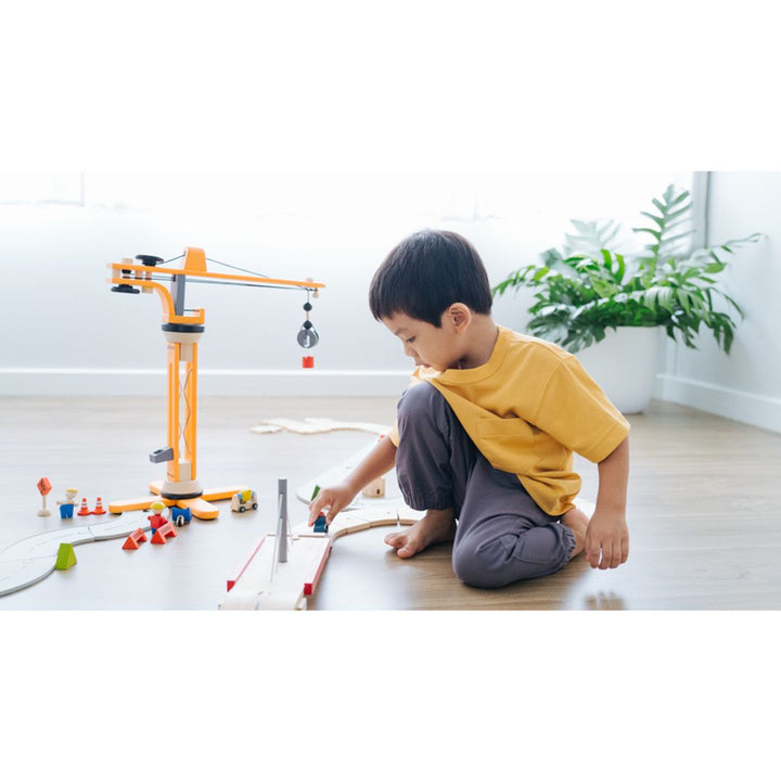 Yellow crane from Plantoys montessori toys