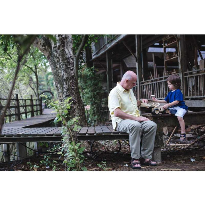 Natural bulldozer made by Plantoys educational toys