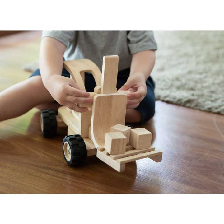 Wooden toy fire truck by PlanWood, perfect for educational play and promoting imaginative fun.