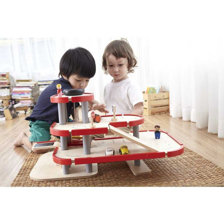 Unlock creativity with Plantoys Parking Garage, a wooden toy that promotes problem-solving.