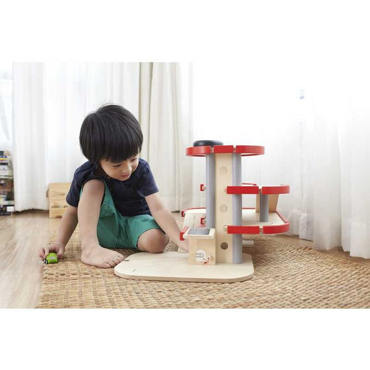 Plantoys Parking Garage is a wood toy designed to engage kids in imaginative, hands-on play.