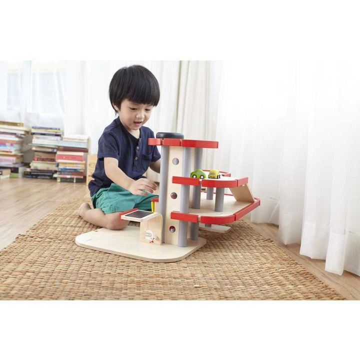 Perfect for toddlers, Plantoys Parking Garage is a Montessori toy that enhances developmental skills.