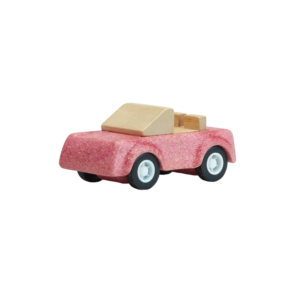 PlanToys Pink Sports Car Children's Creative Play Toy Car. Light pink and natural wood colored car with black and white wheels.