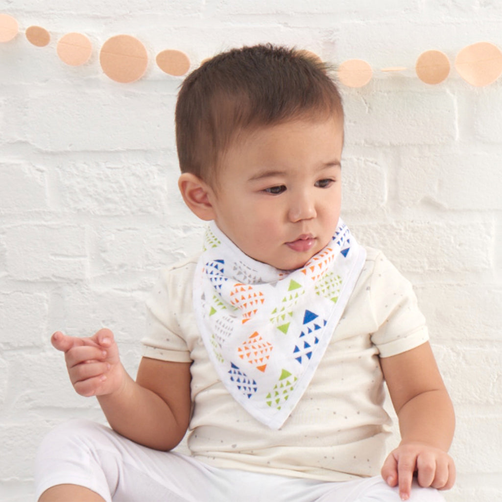 Baby wearing aden + anais Classic Bandana Bib, demonstrating comfort and style.