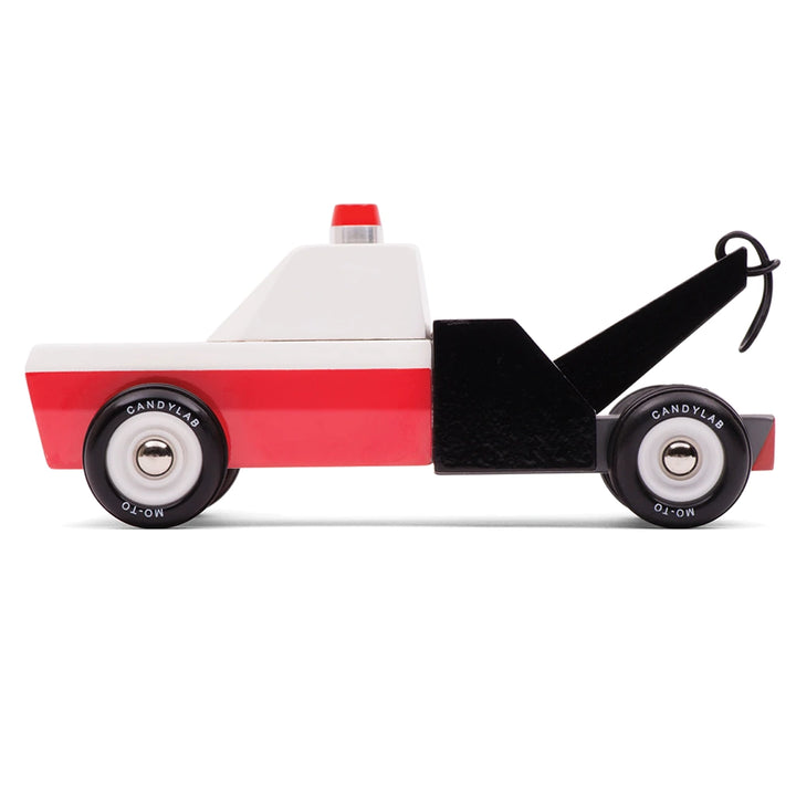 Side view of Candylab Americana Towie Tow Truck, a wooden toy vehicle designed for kids' imaginative play