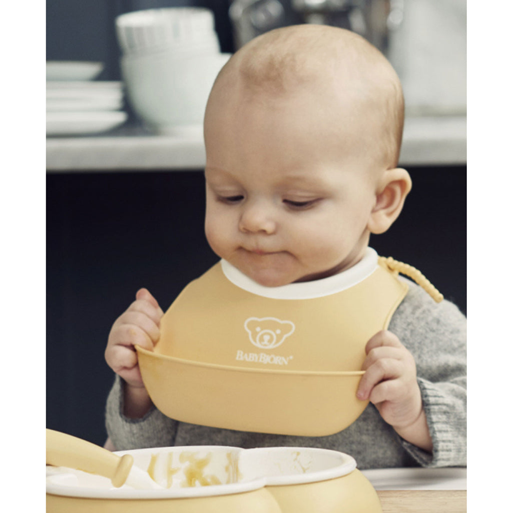 lifestyle_1, BabyBjorn Small Powdered Yellow/Powdered Blue Soft Bibs - 2 Pack
