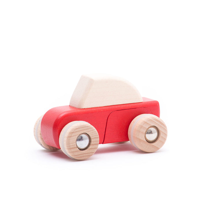 A set of Bajo wooden race cars for kids, encouraging fast-paced play and imaginative racing games.