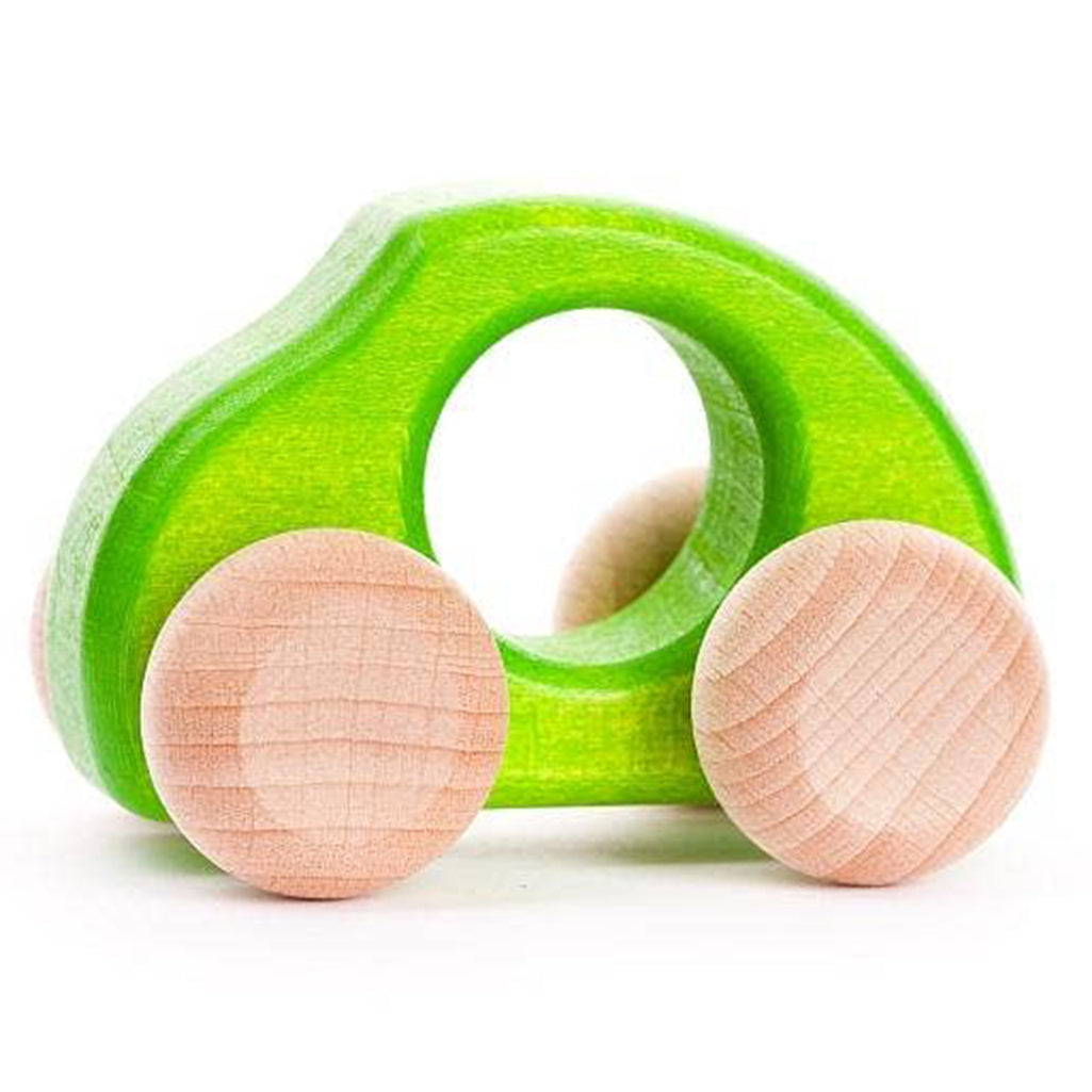 BAJO green wooden car toy with a smooth, rounded design.