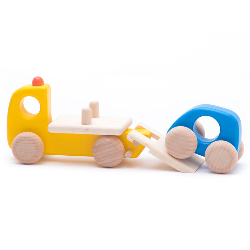 Wooden breakdown lorry by BAJO, designed for imaginative car repair play.
