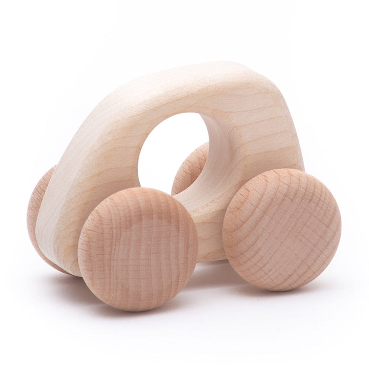 Natural wooden mini car by BAJO, minimalist design for toddlers.