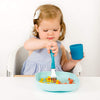 Toddler Eating From Béaba Silicone Children's Suction Bottom Plate