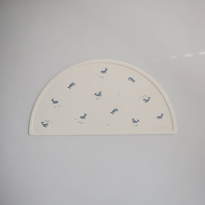 Mushie Baby Placemats in Blue Whale Adorable whale designs that bring a bit of the ocean to your dining space