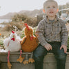 Bunnies By The Bay Randy the Rooster brown red and yellow children's stuffed animal toy. lifestyle of child playing with stuffed animals
