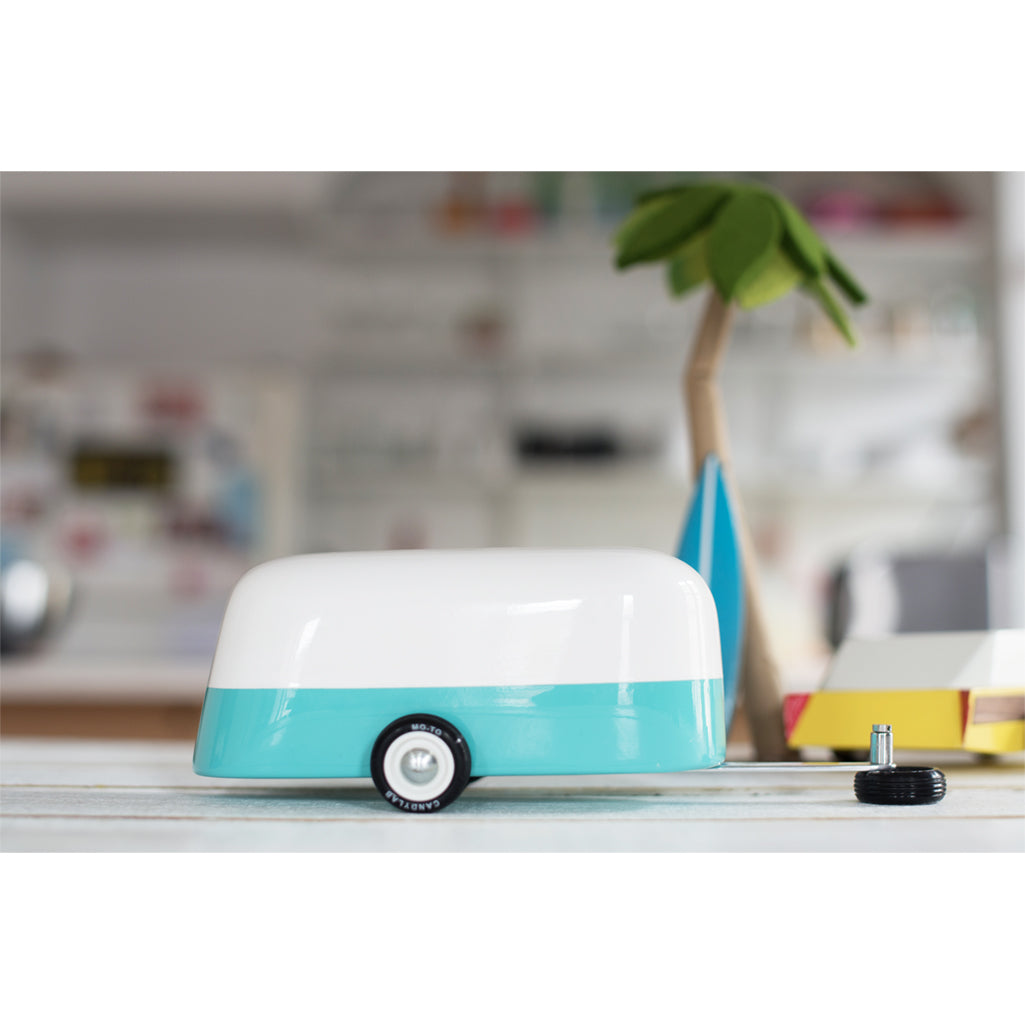 Wooden toy cars by Candylab, available in vibrant colors.