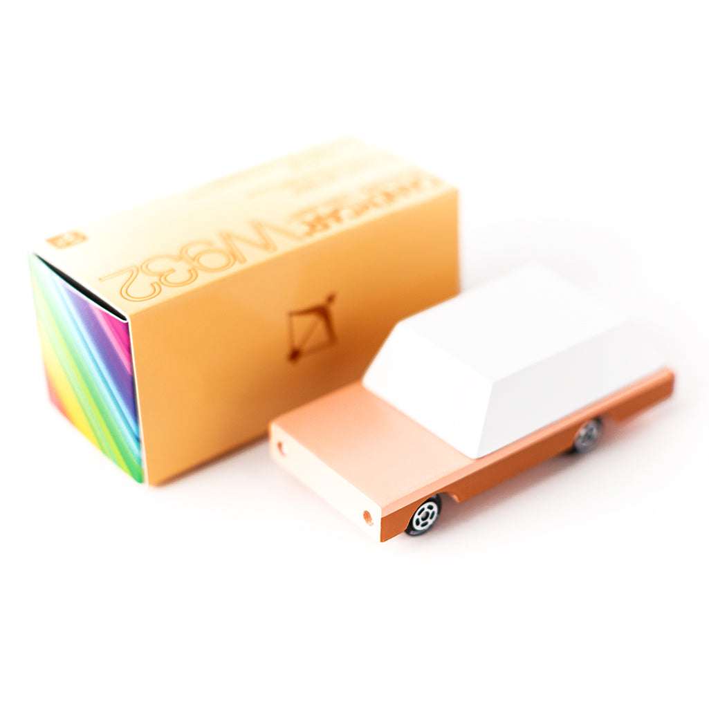 Candylab's Orange Dart Wagon, a retro-inspired wooden car with its packaging.