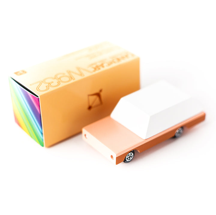 Candylab's Orange Dart Wagon, a retro-inspired wooden car with its packaging.