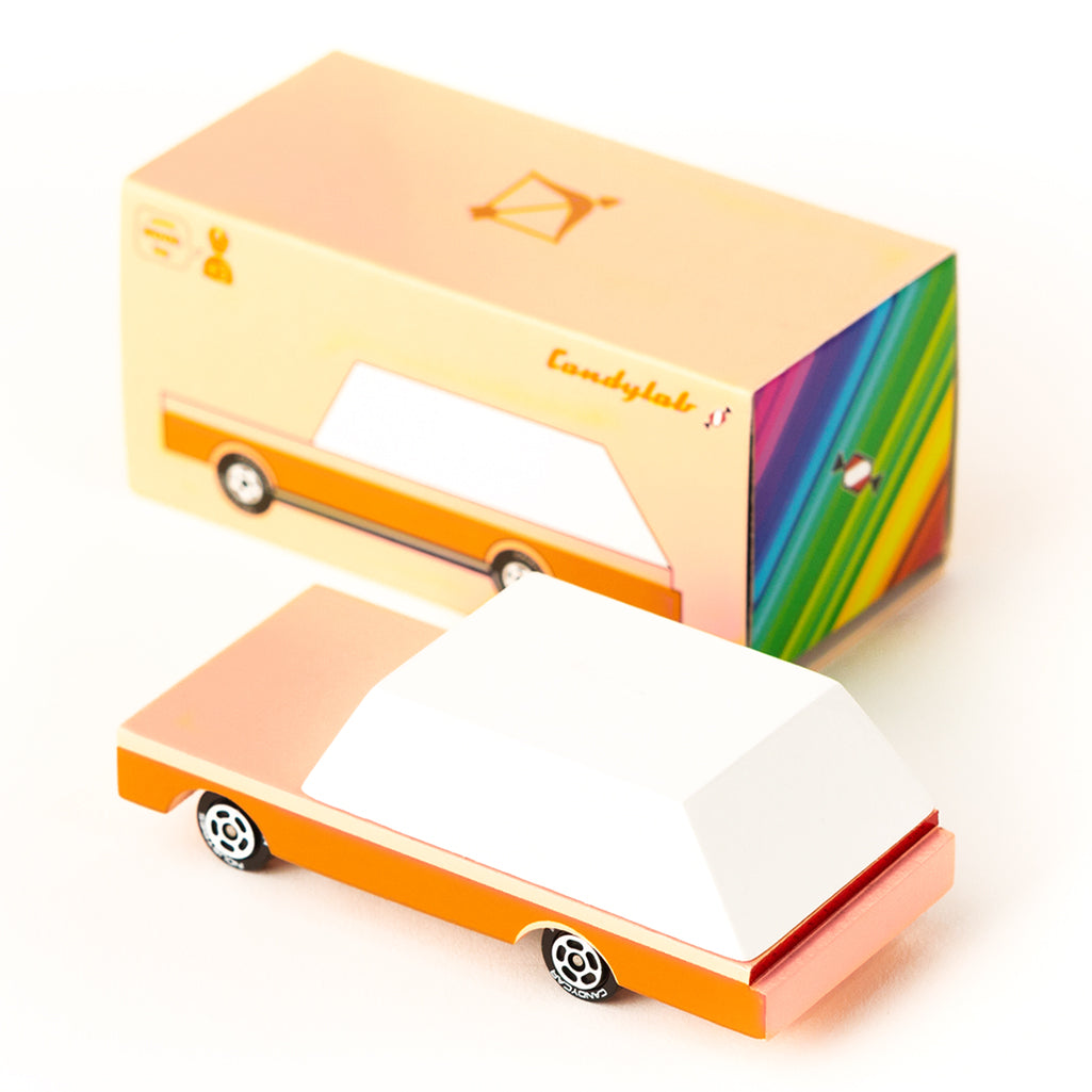 Candylab's orange-and-white Dart Wagon wooden toy car, ready for fun.